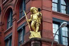 17-2 Gilded Statue By Sculptor Henry Baerer of Shakespeare Character Puck From A Midsummers Night Dream On The Puck Building 295-307 Lafayette St In Nolita New York City